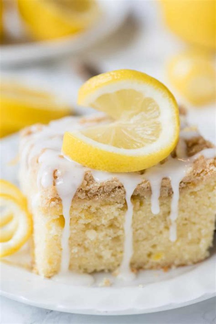 Slice of lemon crumb cake on a white plate.