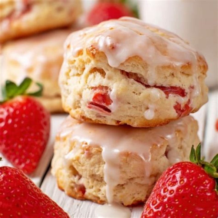 Two strawberry biscuits stacked on top of each other.